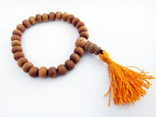 Load image into Gallery viewer, Sandalwood Mala Beads Bracelet stretches with orange tassel 8mm beads naturally aromatic