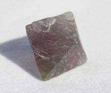 Load image into Gallery viewer, Fluorite Octahedron - slightly cloudy 1 inch size