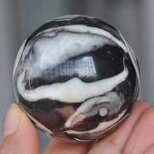 Load image into Gallery viewer, Coral Shell Jasper Sphere looks like a piece of abstract art 50mm wide