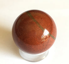 Load image into Gallery viewer, Red Jasper sphere for increased confidence, drive and ambition.  32mm diameter