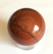 Load image into Gallery viewer, Red Jasper sphere for increased confidence, drive and ambition.  32mm diameter