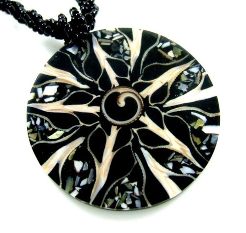 Black Cone Shell, Shiva Shell and Abalone Shell Medallion on black beaded rope.