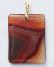Load image into Gallery viewer, Brazilian Agate Pendant 2 inch oblong in vivid orange with Chevron Banding