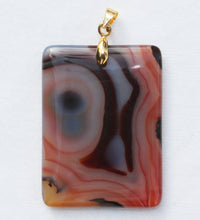 Load image into Gallery viewer, Brazilian Agate Pendant 2 inch oblong in vivid orange with Chevron Banding