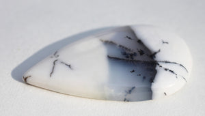 Merlinite Cabochon in teardrop shape.