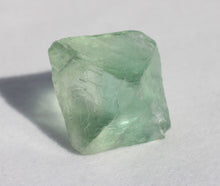 Load image into Gallery viewer, Fluorite Octahedron - slightly cloudy 1 inch size
