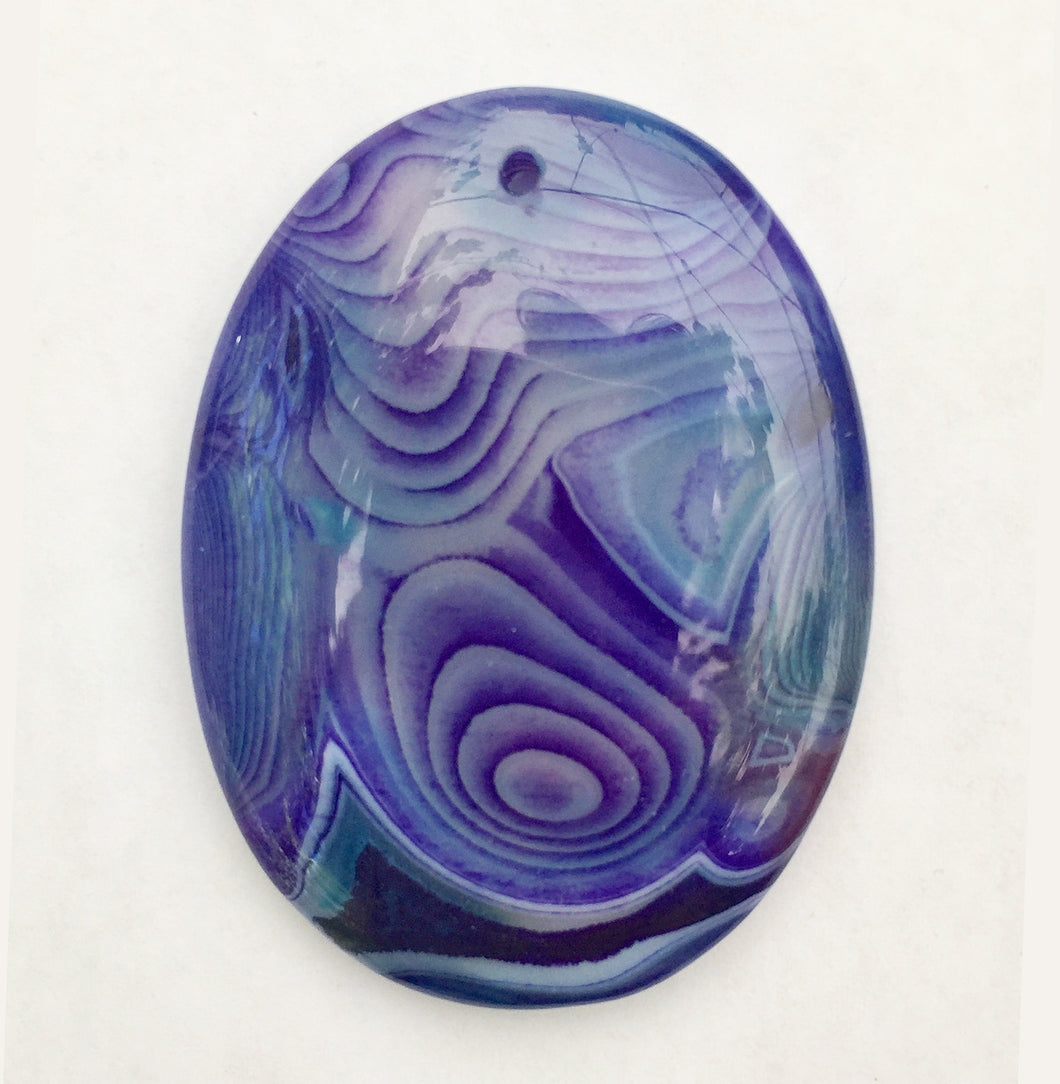 Onyx Oval Focal Bead (dyed blue) - fantastic patterns