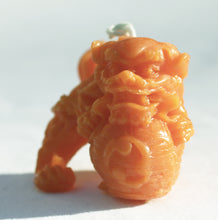 Load image into Gallery viewer, Foo Dog Beeswax Candle in True Orange 2 inches high