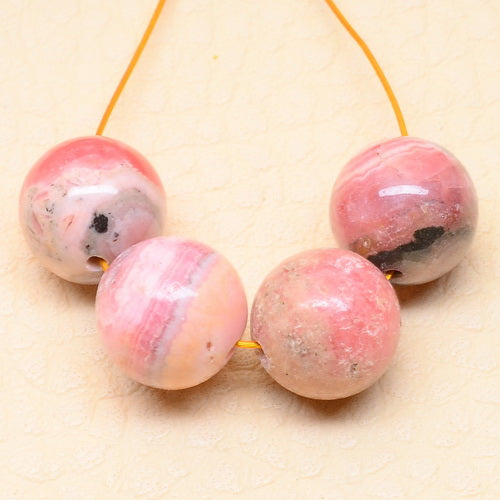 Rhodochrosite - Group of Four B Grade 9.5mm Round Beads with Pretty Patterning
