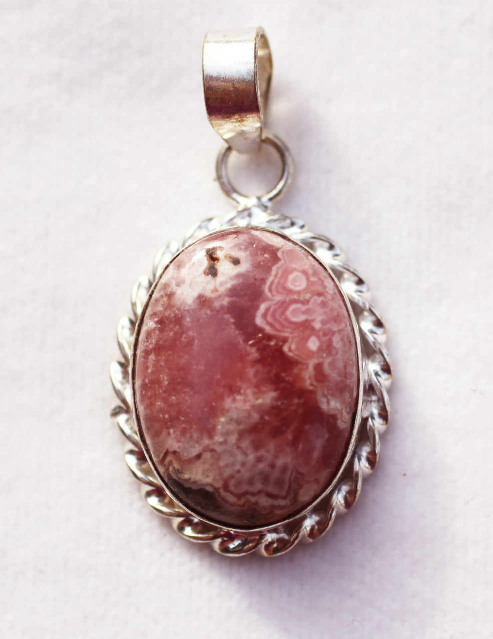 Rhodochrosite Pendant in oval shape in sterling silver - a master balancing crystal