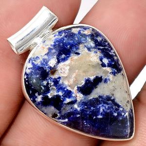 Sunset Sodalite pendant in petal shape setting with a tube bail