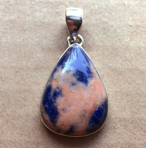 Orange and Blue Sunset Sodalite pendant in sterling silver pear setting