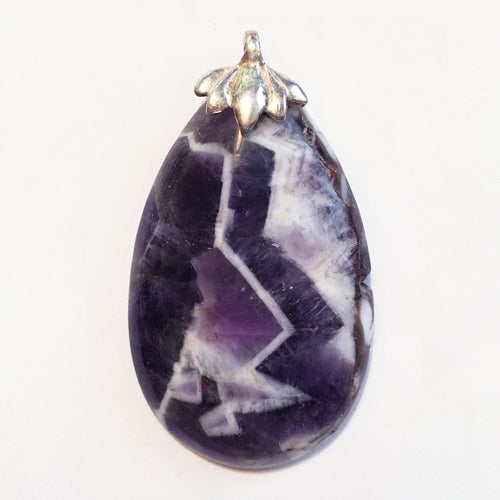 Chevron Amethyst pendant in pear shape with sterling silver lotus bail.