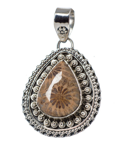 Fossilized Coral pendant for wise financial planning