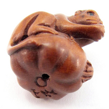 Load image into Gallery viewer, Monkey Ojime Bead of a Monkey sitting on a pumpkin