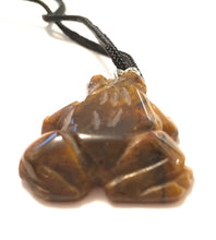 Load image into Gallery viewer, Golden Tigers Eye Frog Fetish Pendant on Black Cord - light hue